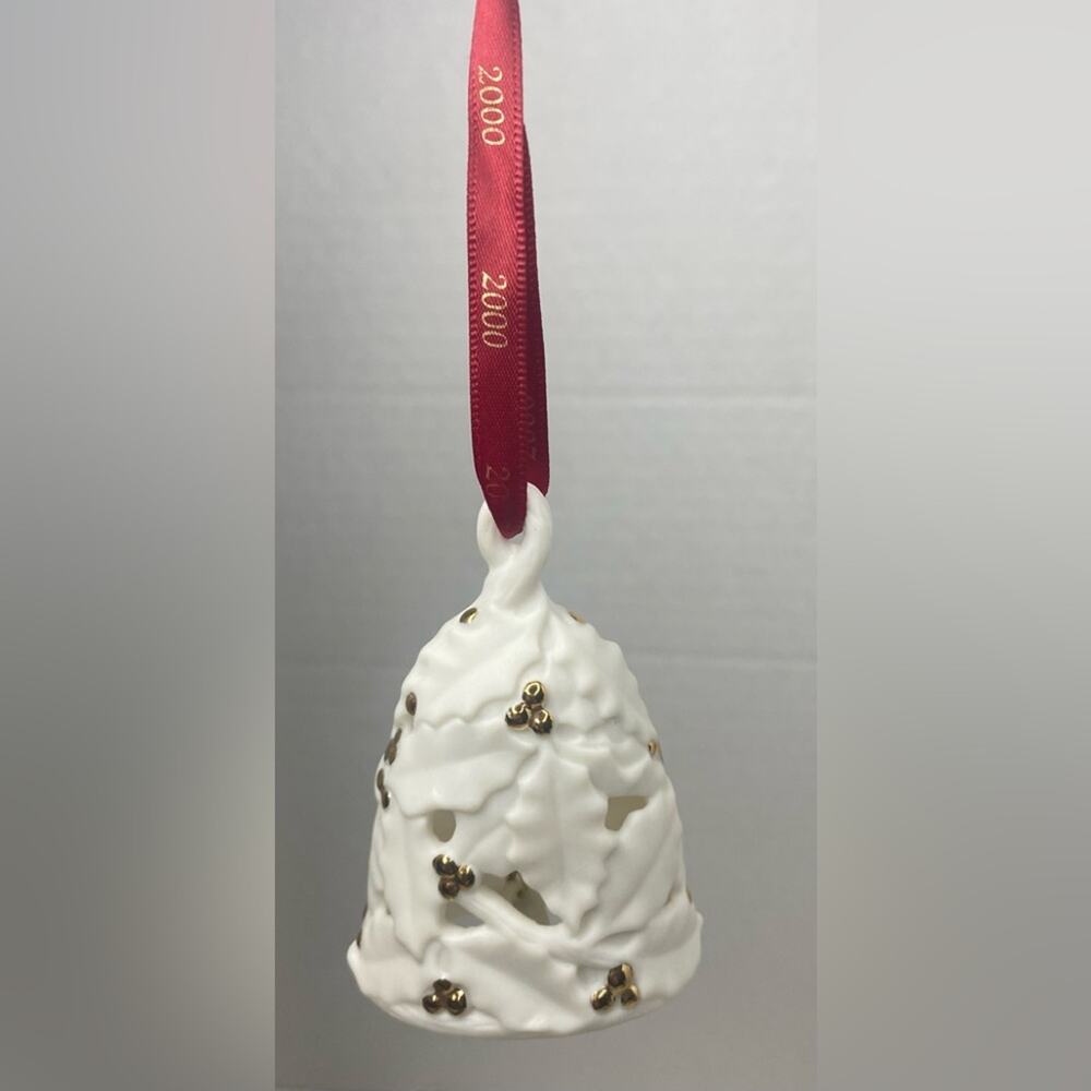 Hallmark Keepsake ornament . Fine porcelain Holly decor with bell inside “2000”
